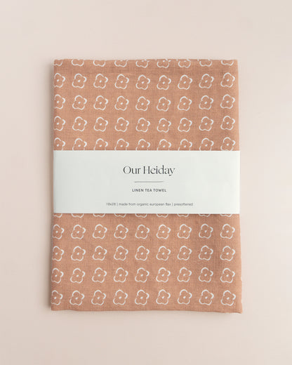 Sienna colored tea towel with a floral pattern by our heiday 
