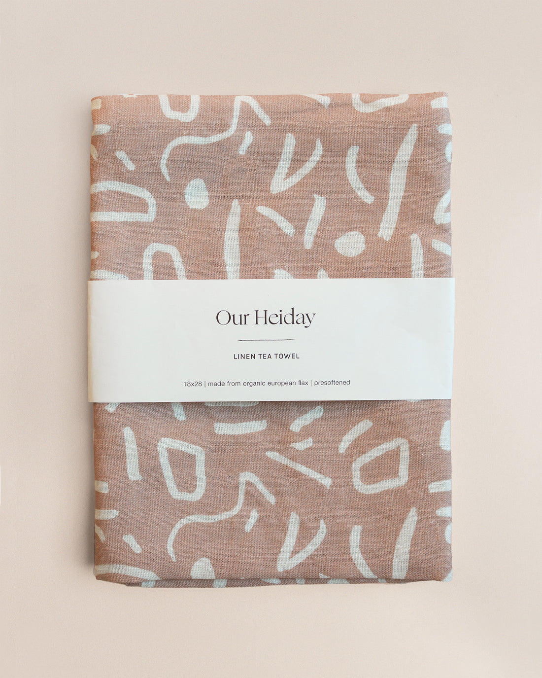 neutral toned linen tea towel with white painterly shapes