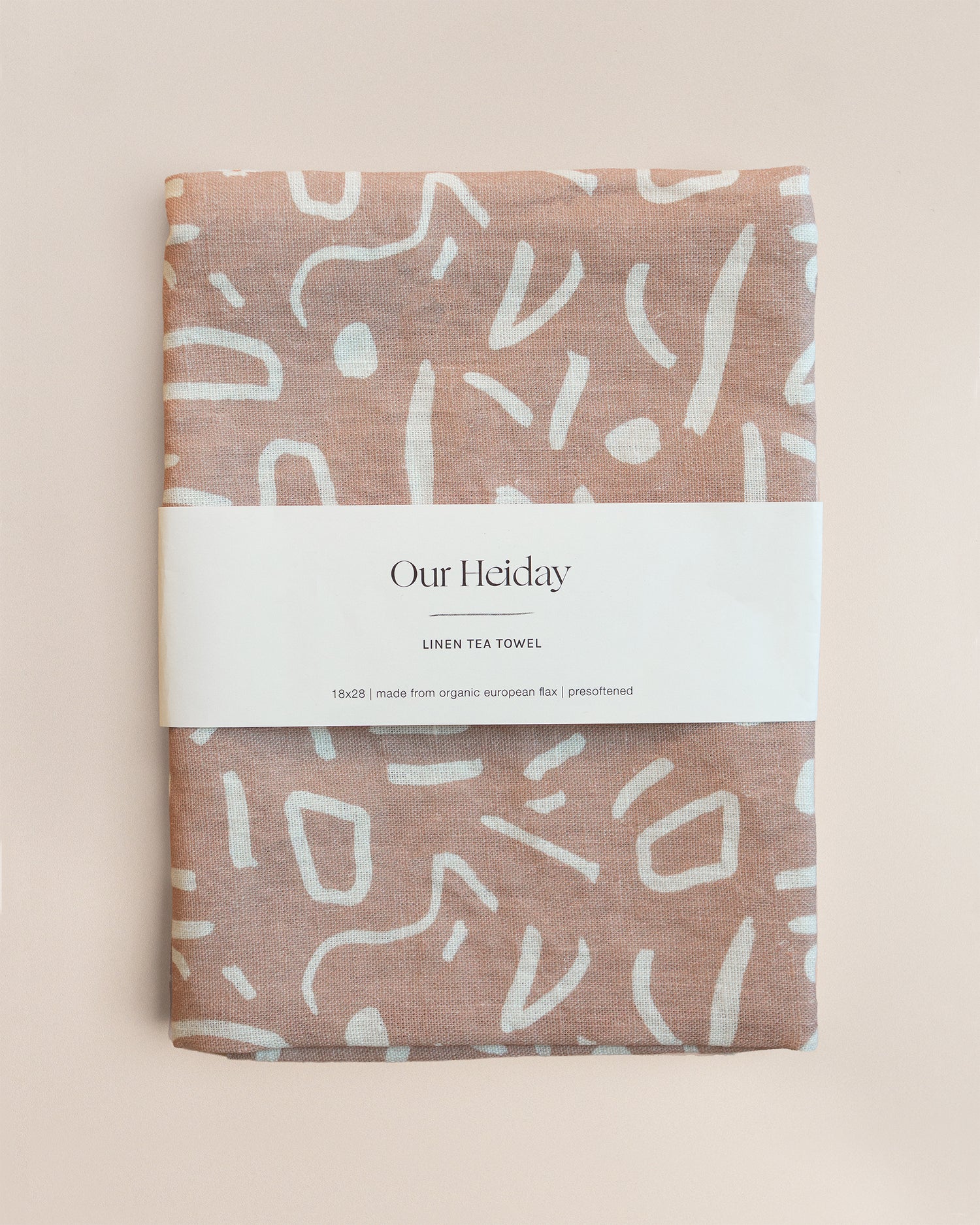 neutral toned linen tea towel with white painterly shapes