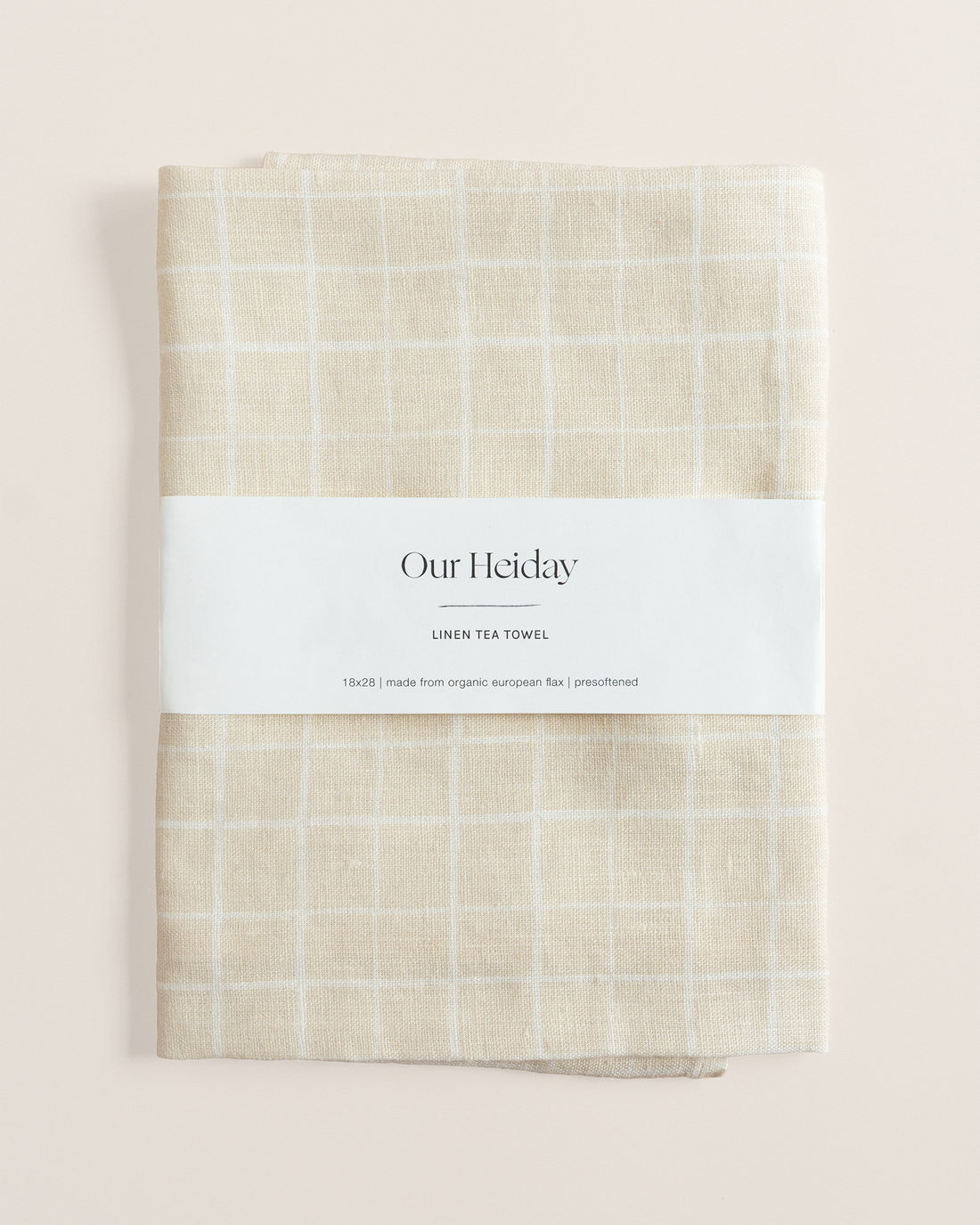 Linen tea towel with loose grid tan pattern
