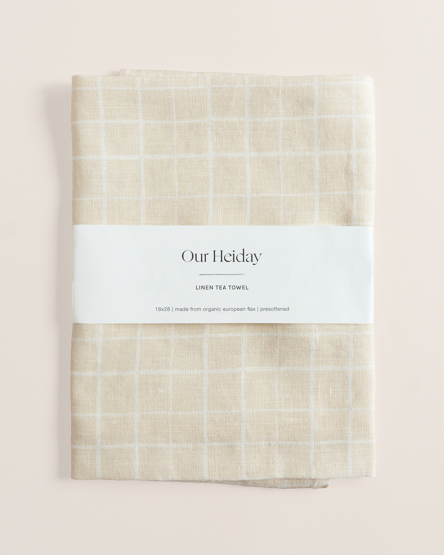Linen tea towel with loose grid tan pattern