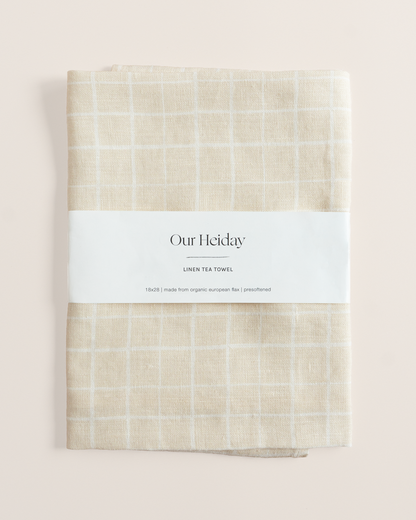 Linen tea towel with loose grid tan pattern