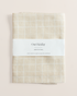 Linen tea towel with loose grid tan pattern